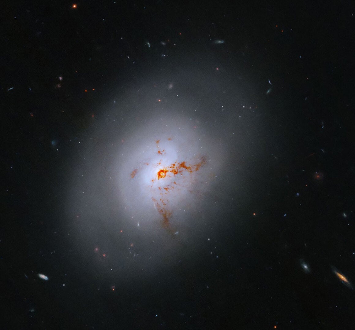 This NASA Hubble Space Telescope image reveals the lenticular galaxy, NGC 1266. This enigmatic post-starburst galaxy has a bright center and a face that hints at spiral structure, yet it holds no discernible spiral arms. Credit: NASA, ESA, K. Alatalo (STScI); Image Processing: G. Kober (NASA/Catholic University of America)