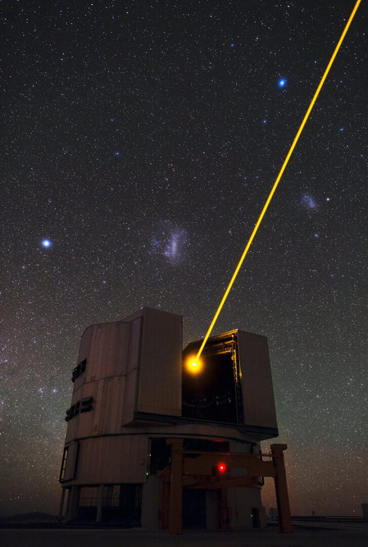 This image shows Yepun, the fourth 8.2-metre Unit Telescope of ESO’s Very Large Telescope (VLT) facility, launching a powerful yellow laser beam into the sky. Credit: ESO/B. Tafreshi