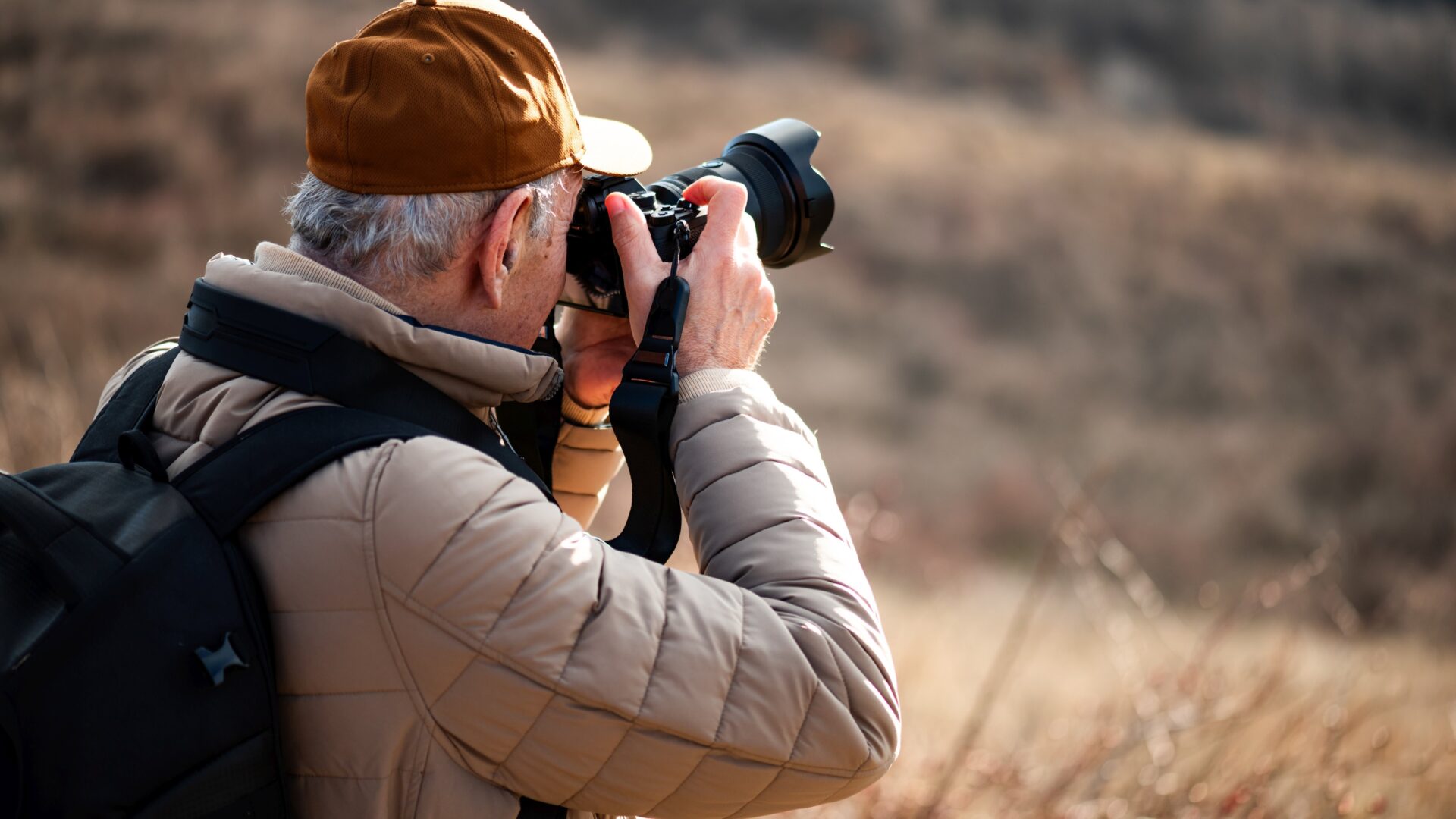 Senior man photographing