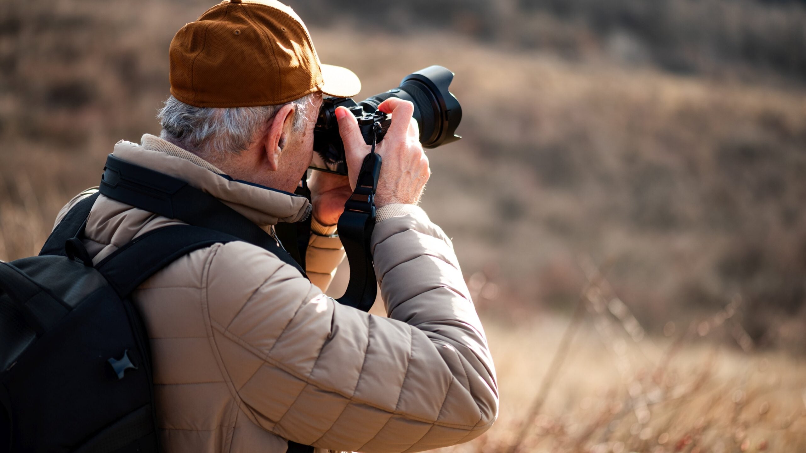 Senior man photographing