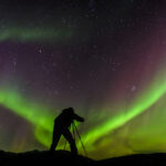 How to Shoot in Low Light: Simple Tips for Better Photos photographer and aurora borealis northern lights
