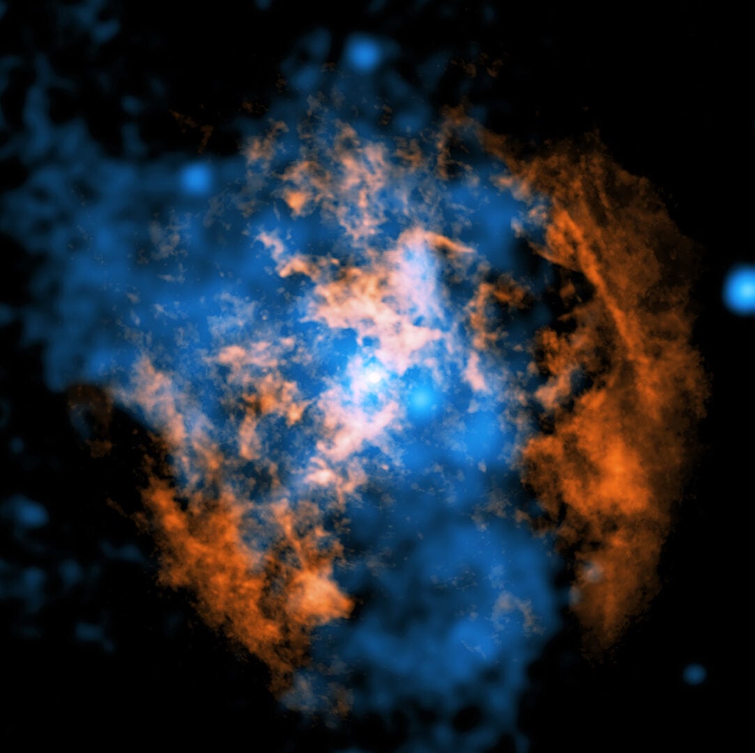This composite image shows the evidence for the wind blowing away from Sgr A*. The white dot in the center of the image shows Sgr A*. Credit: X-ray: NASA/CXC/Northwestern Univ./M. Gorski; Radio:ESO/NAOJ/NRAO/ALMA; Image processing: NASA/CXC/SAO: K. Arcand, P. Edmonds