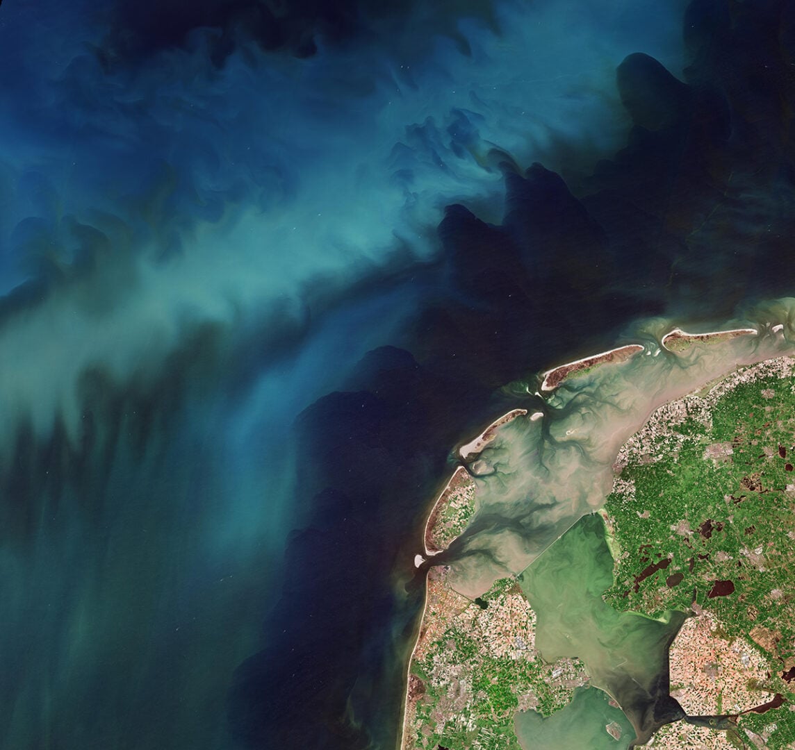 Captured by the Copernicus Sentinel-2 mission on 21 April 2026, this image shows a double bloom in the Netherlands: an array of vibrant colours in the tulip fields as well as the blue-greenish swirls of phytoplankton in the North Sea. Credit: Copernicus Sentinel data (2026), processed by ESA