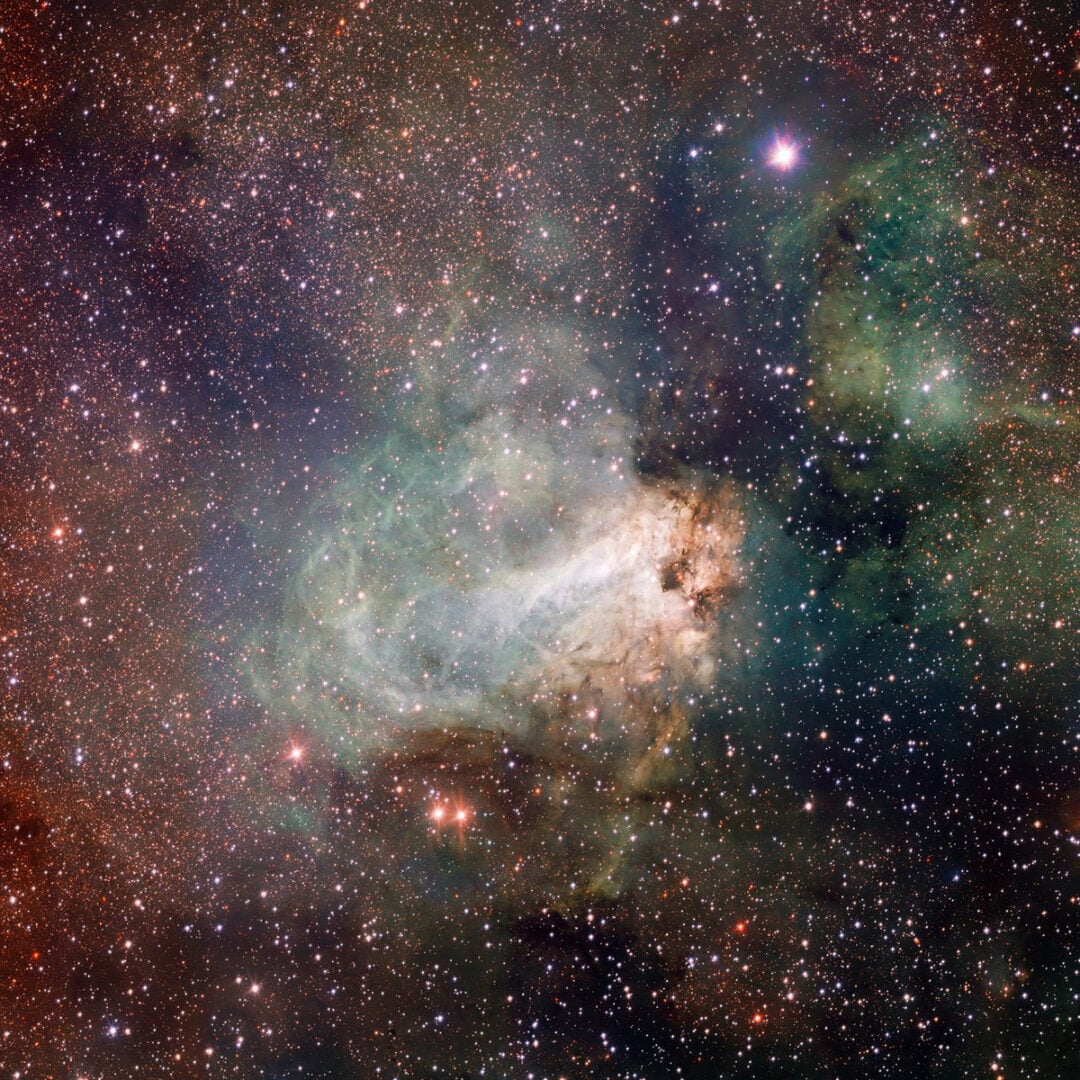 The first released VST image shows the spectacular star-forming region Messier 17, also known as the Omega Nebula or the Swan Nebula. Credit: ESO/INAF-VST/OmegaCAM. Acknowledgement: OmegaCen/Astro-WISE/Kapteyn Institute