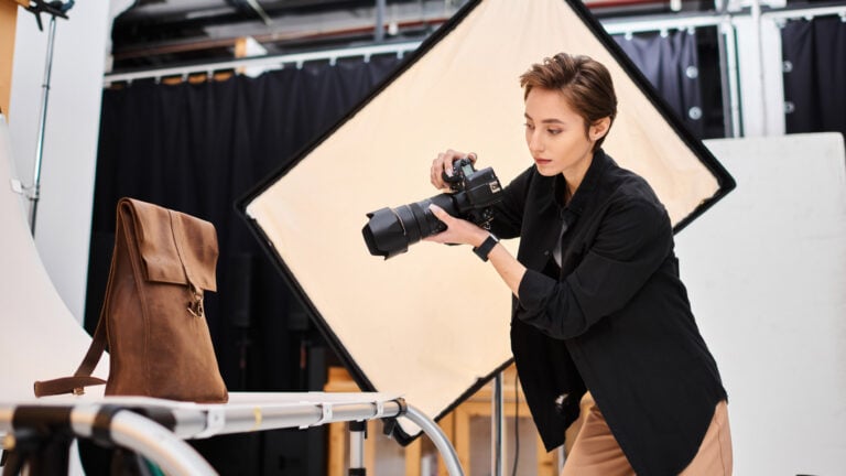 From Products to People: What Is a Commercial Photographer? woman photographing a bag in a studio