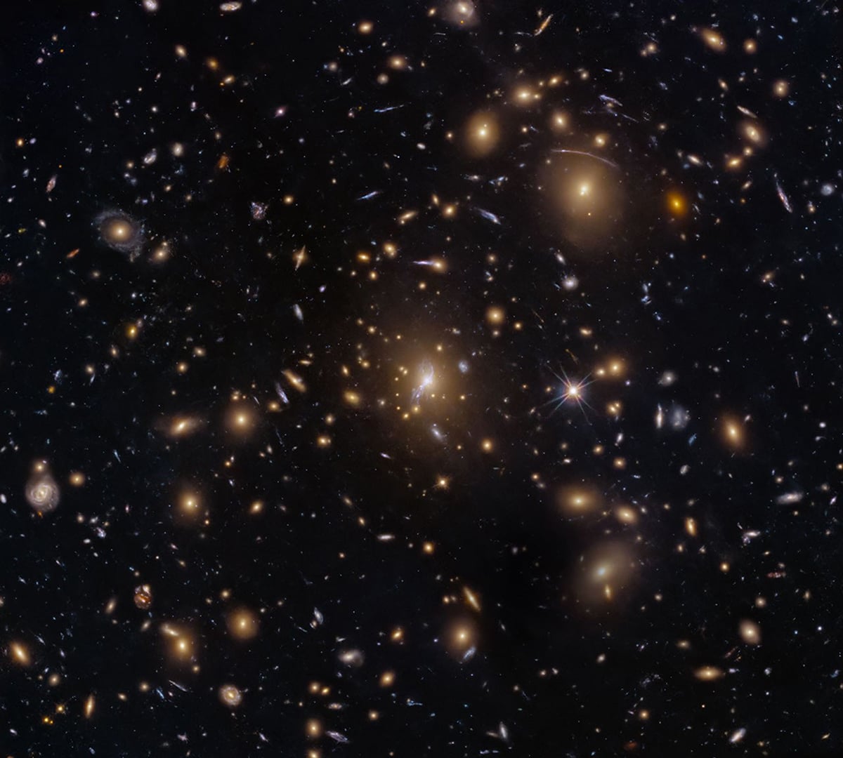 This NASA Hubble Space Telescope image features the galaxy cluster MACS0329-0211. Credit: NASA, ESA, M. Postman (STScI); Image Processing: G. Kober (NASA/Catholic University of America)