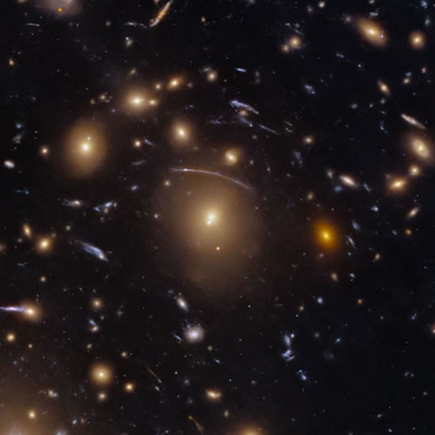 Gravitational lensing recorded in Hubble's image. Credit: NASA, ESA, M. Postman (STScI); Image Processing: G. Kober (NASA/Catholic University of America)