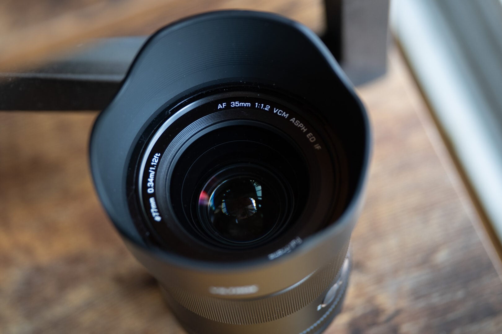 Viltrox 35mm F1.2 LAB N FE's front element show with a petal hood.