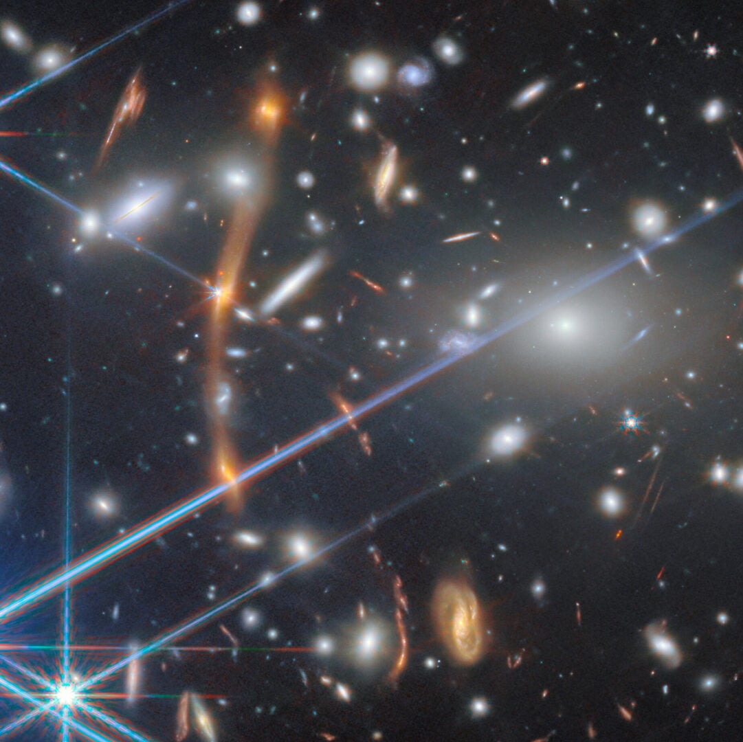 A few of the many instances of gravitational lensing in JWST's image. Credit: ESA/Webb, NASA & CSA, S. Fujimoto