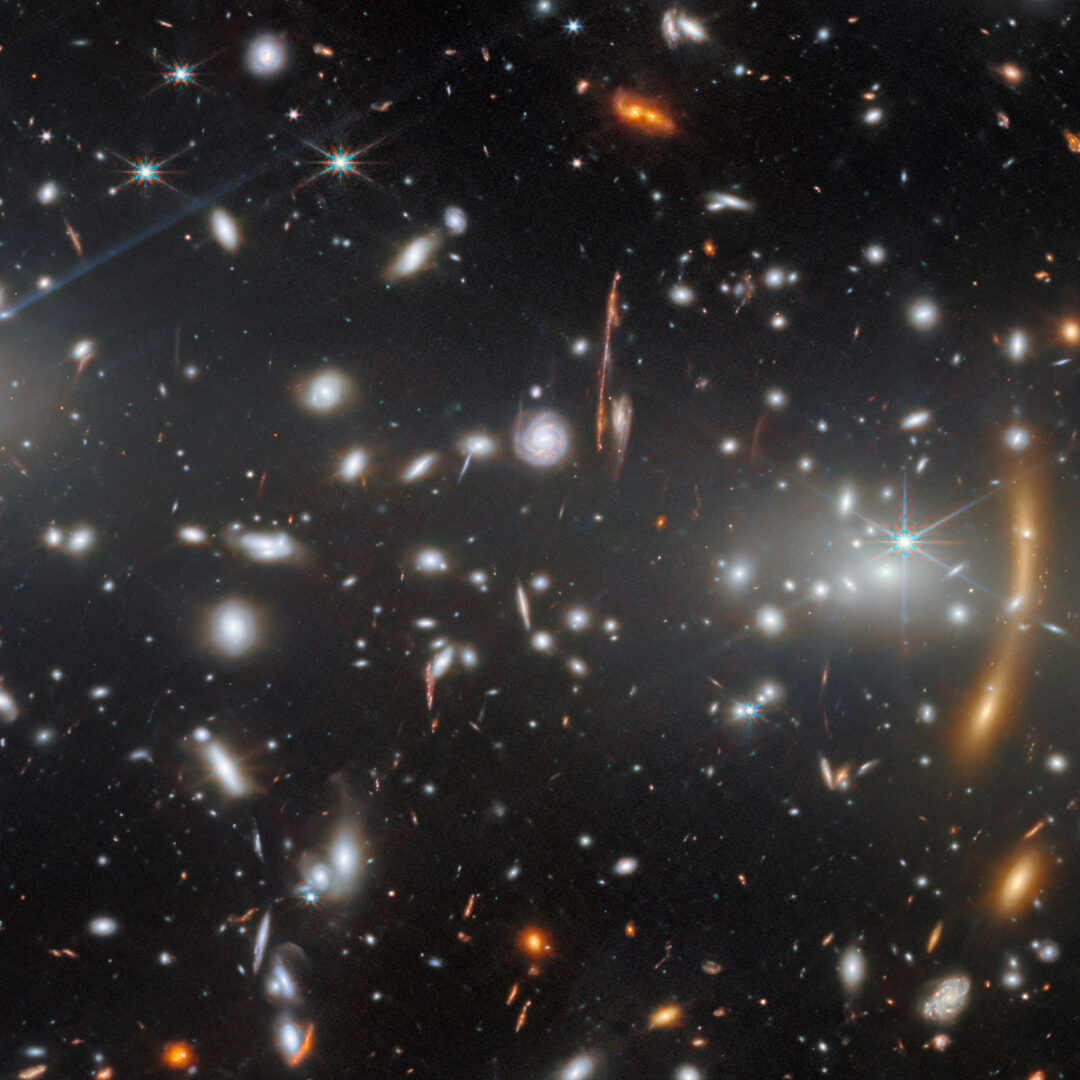 At the center of the larger image, along with the galaxy cluster MACS J0553.4-3342, a great number of background galaxies are visible. Credit: ESA/Webb, NASA & CSA, S. Fujimoto