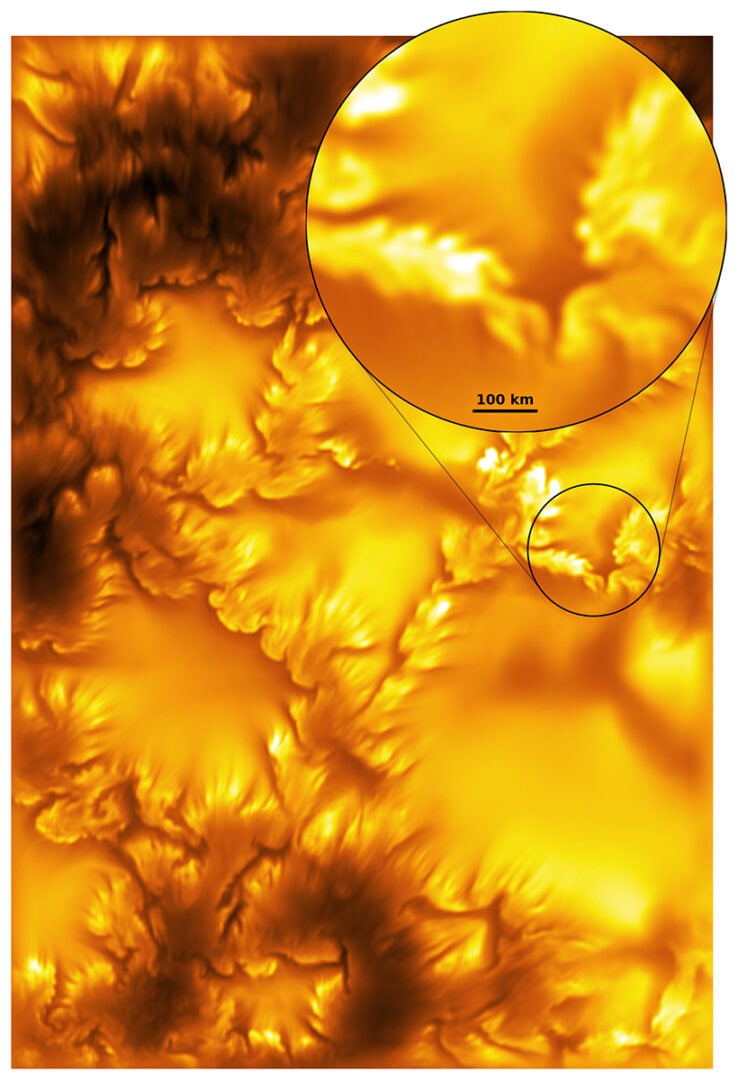 A close-up view from the Inouye Solar Telescope image highlighting a region of the solar photosphere. The enlarged inset reveals the fine-scale magnetic structures and dark striations associated with the Kelvin-Helmholtz instability at a scale of tens of kilometers. Credit: NSF/NSO/AURA/MPS