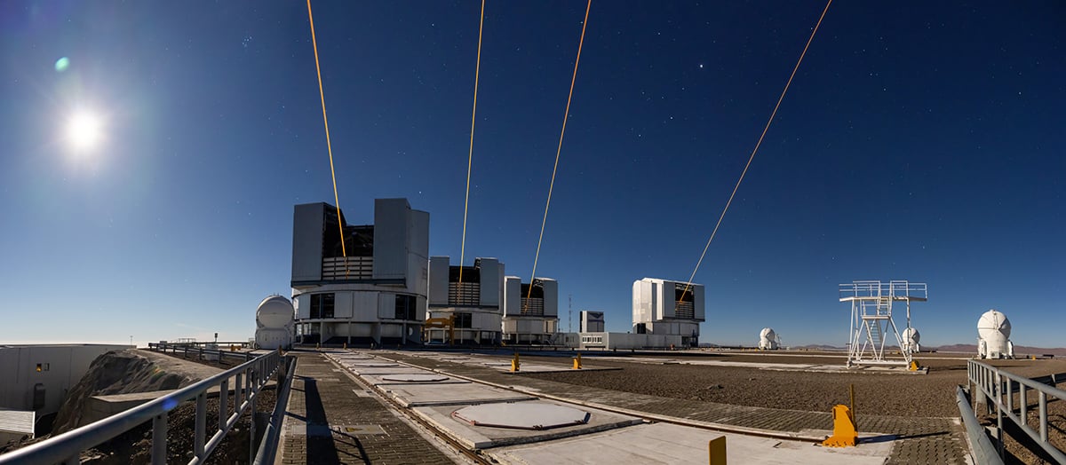 This photograph shows four lasers at ESO’s Very Large Telescope Interferometer (VLTI). Credit: A. Berdeu/ESO