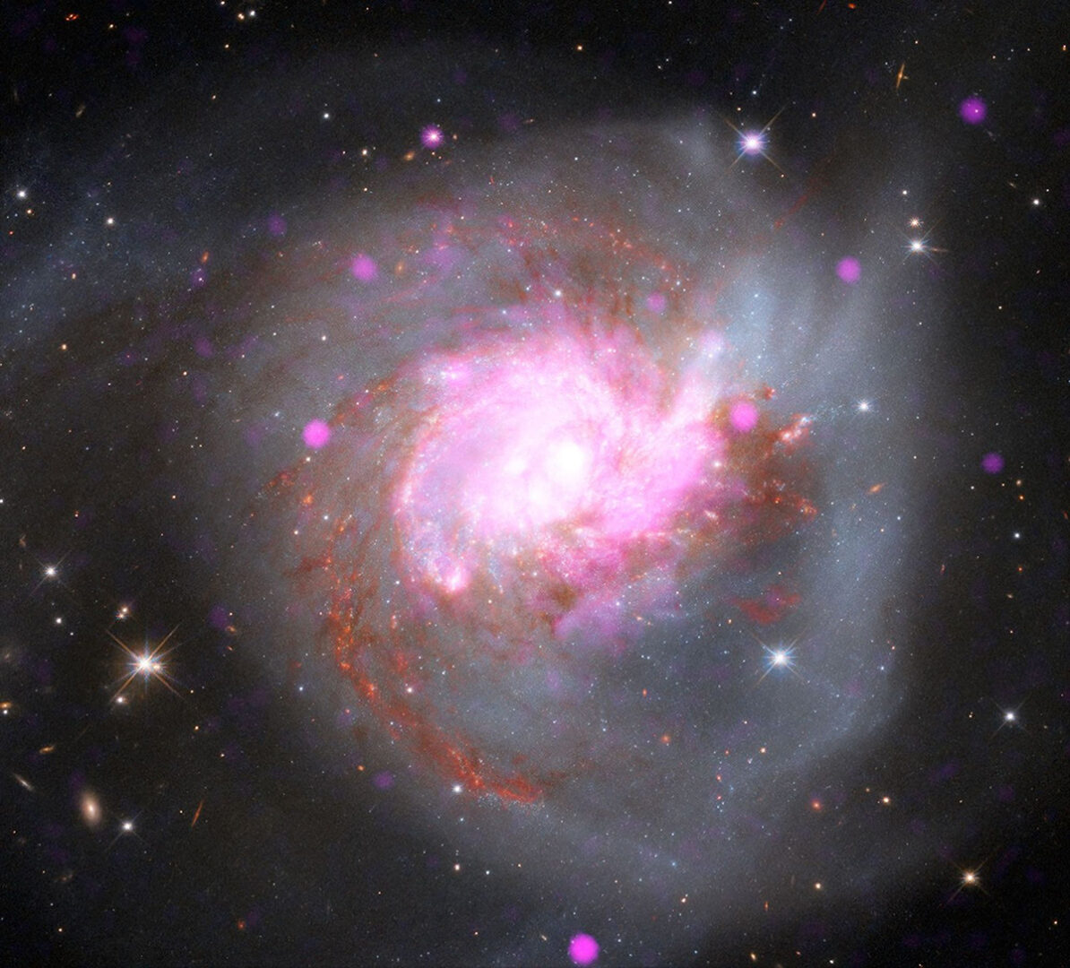 NGC 3256. Credit: X-ray: NASA/CXC/SAO; Optical: NASA/ESA/STScI; Infrared: NASA/ESA/CSA/STScI; Image Processing: NASA/CXC/SAO/L. Frattare