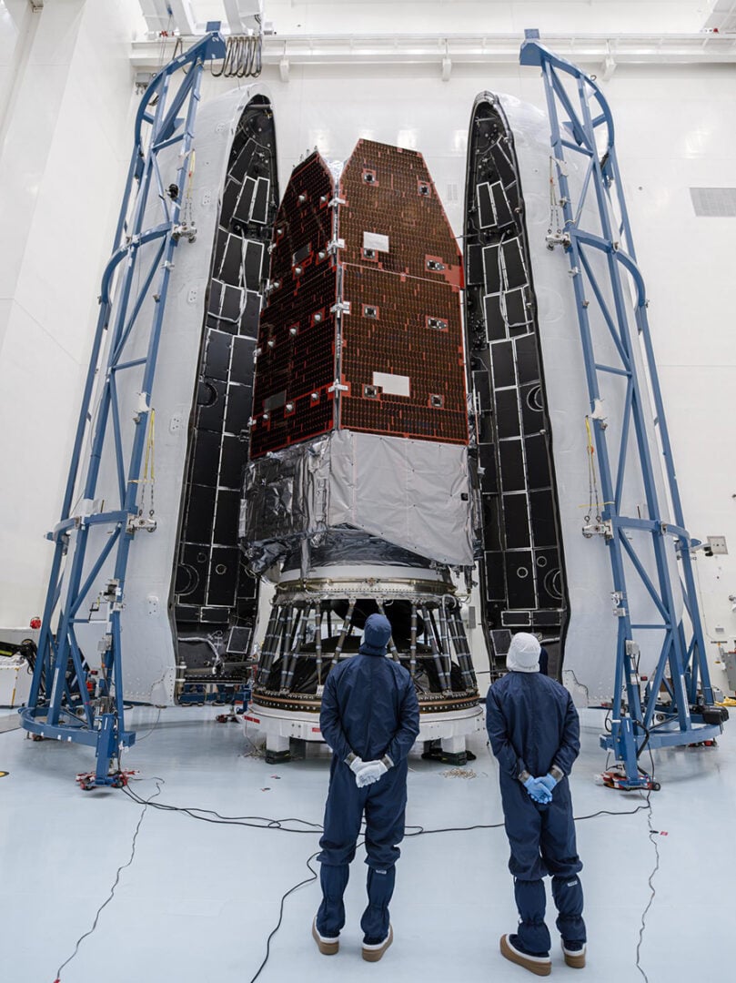 Teams inside the Payload Hazardous Servicing Facility at NASA’s Kennedy Space Center in Florida encapsulate the agency’s Nancy Grace Roman Space Telescope within the payload fairing on Friday, Aug. 21, 2026. Credit: NASA/Sydney Rohde (Rocz)