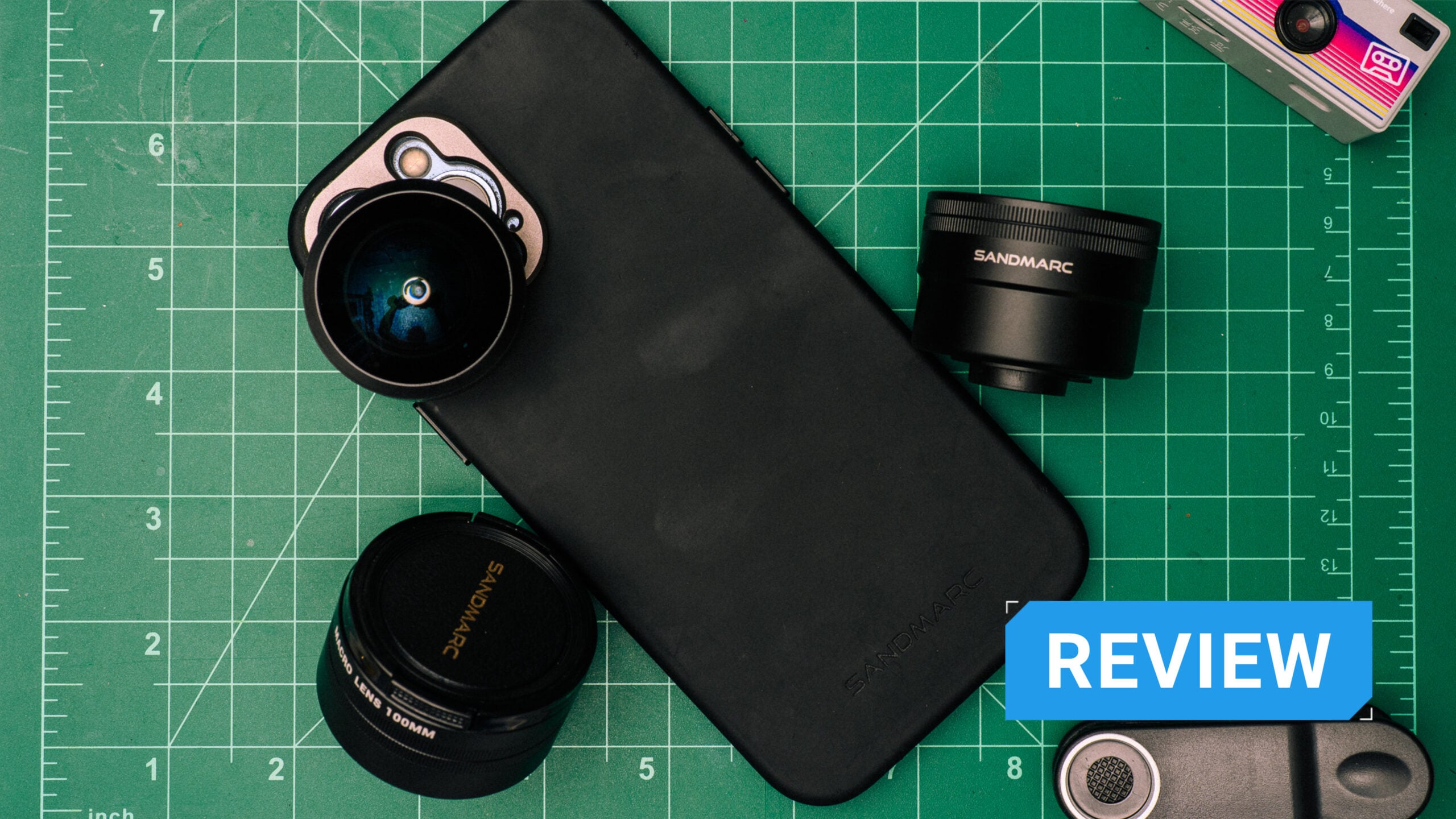 SANDMARC Mobile Photography Kit displayed on a green cutting mat.