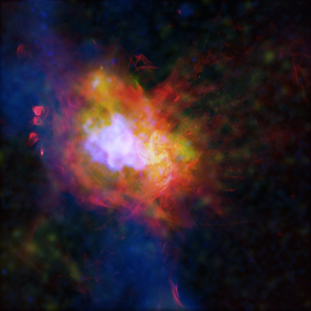 A composite image of a supermassive black hole and supernova remnant at the center of our Milky Way Galaxy. Credit: X-ray: NASA/CXC/McGill Univ./M. Balakrishnan et al.; Radio: NSF/NRAO/VLA; Sub-mm: EAO/James Clerk Maxwell Telescope; Image Processing: NASA/CXC/SAO/P. Edmonds, N. Wolk