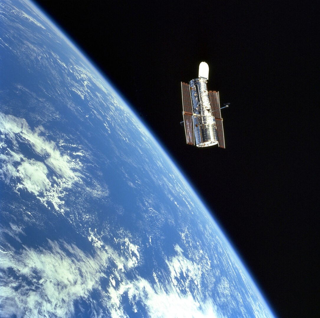 Hubble Space Telescope with Earth in the background. Credit: NASA