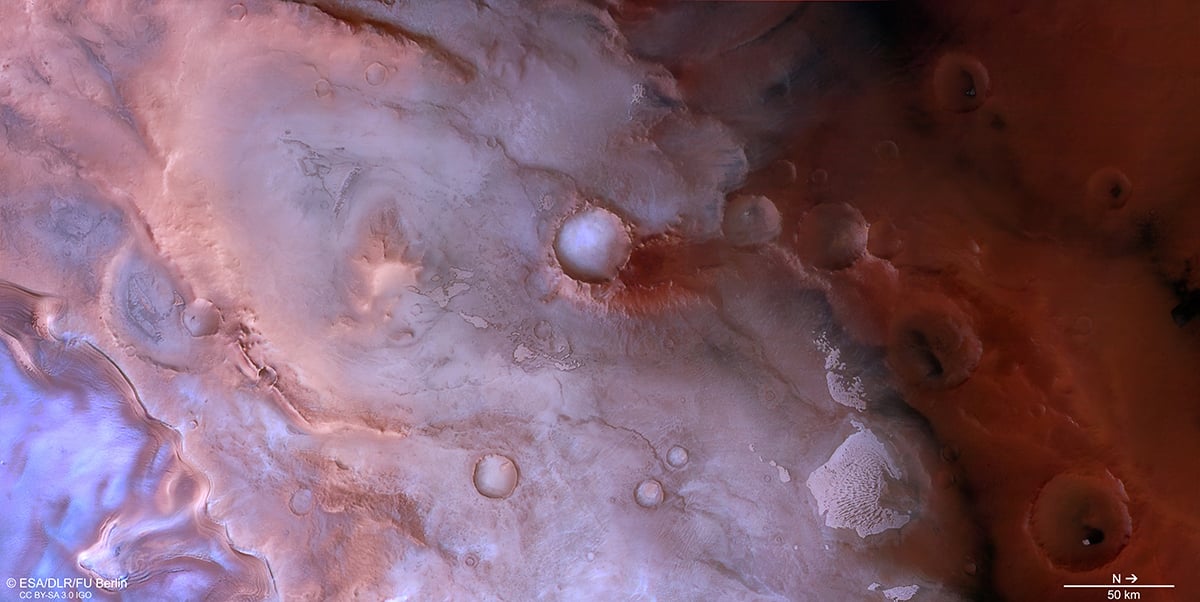 ESA’s Mars Express has imaged beautiful swirls of purple, pink, and red near Mars’s south pole. Credit: ESA/DLR/FU Berlin