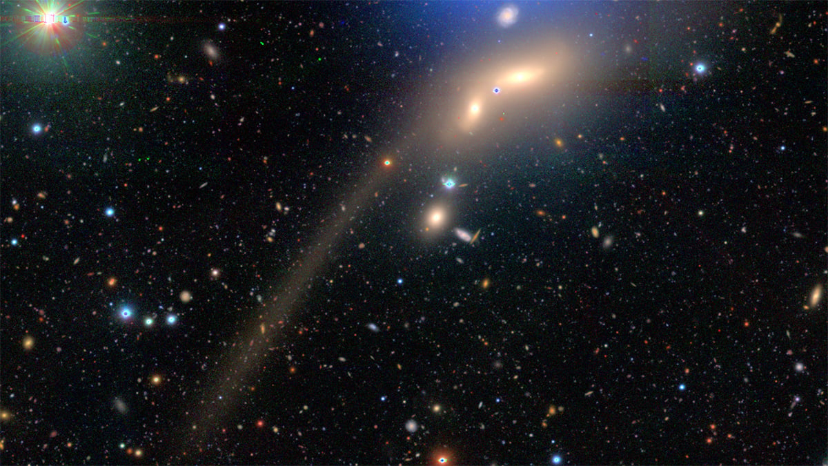 Subaru Telescope captures two interacting galaxies and a long tail cover