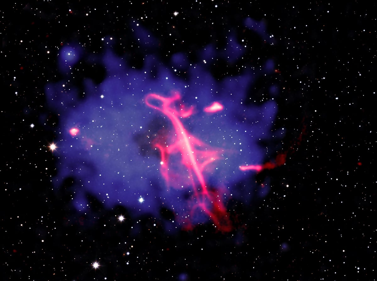 The composite image of VLSS J0318.9+5755, the cosmic "treble clef". Credit: X-ray: NASA/CXC/INAF-IRA/A. Botteon et al.; Infrared: UKIDSS-GPS; Radio: ASTRON/LOFAR; Image processing: NASA/CXC/SAO/N. Wolk